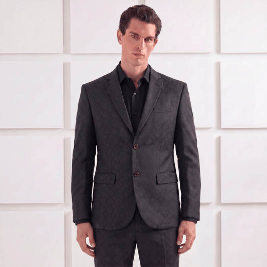 Man wearing a Jacquard Evening suit against a white paneled wall