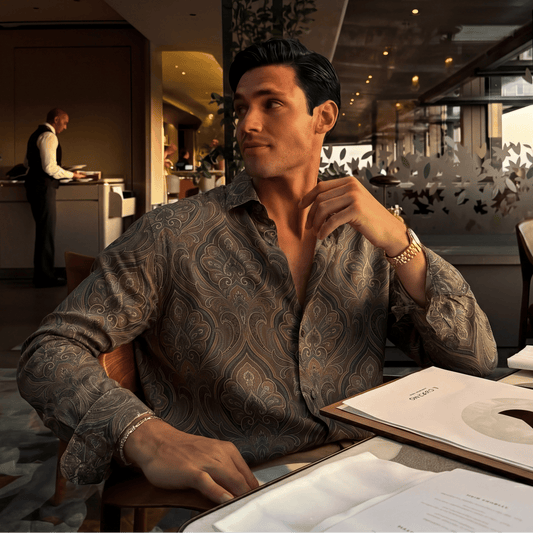 Paisley motif fluid drape shirt styled for casual soiree with rolled sleeve