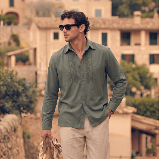 Olive green Tencel shirt styled for casual outdoor wear with linen pants