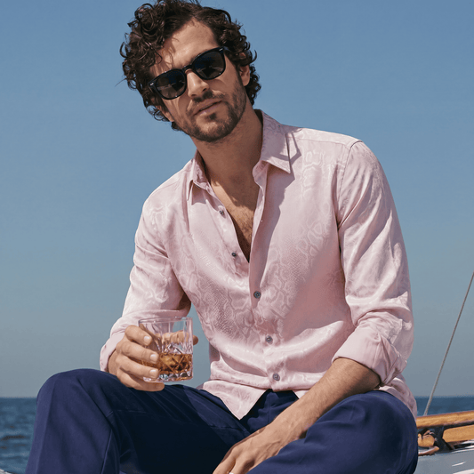 Pink viscose jacquard shirt rolled sleeves worn open on boat for summer soiree