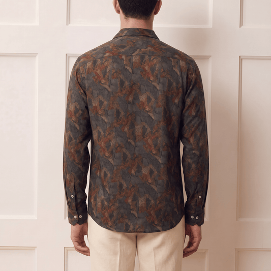 Back view of men's abstract expressionist print Cuban collar viscose shirt in earthy tones