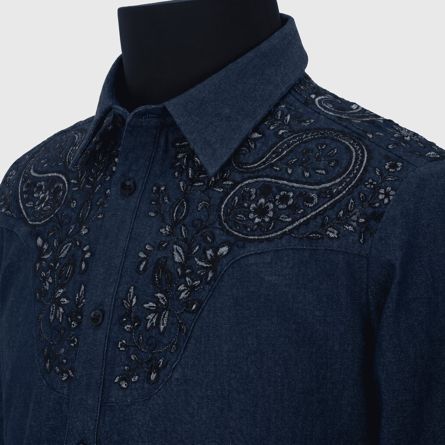 Blue Denim embroidered shirt on a mannequin with a white background