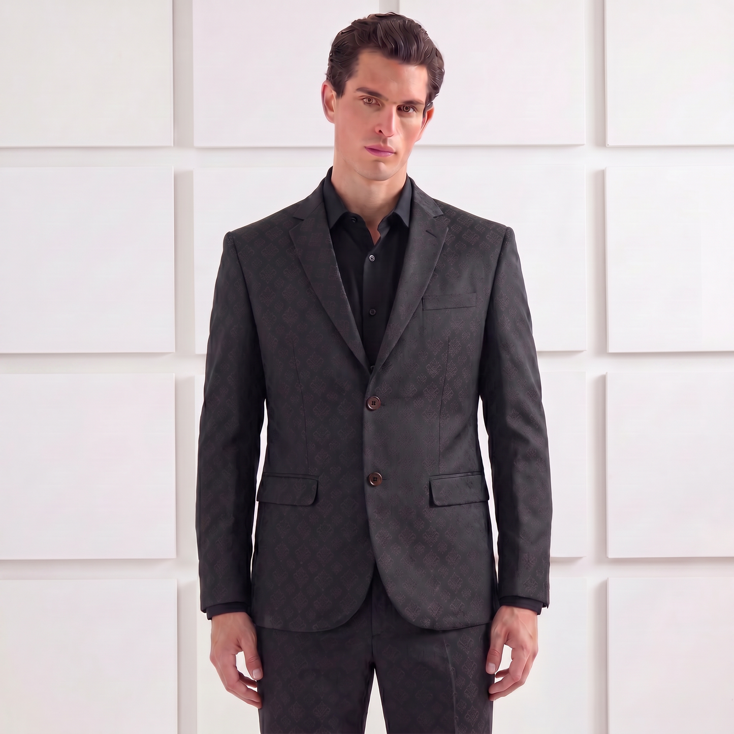 Man wearing a Jacquard Evening suit against a white paneled wall