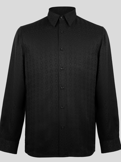 A black long-sleeve button-up shirt with a subtle geometric damask pattern, shown on a neutral gray background.