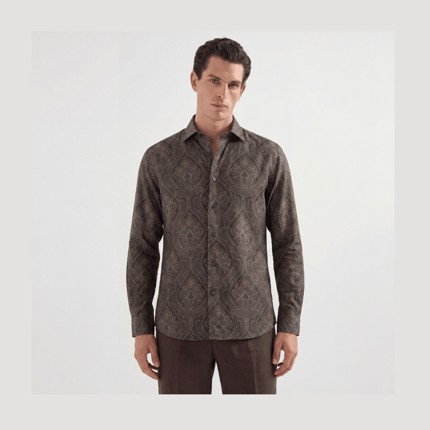 Brown and taupe paisley viscose button-up shirt on dark gray