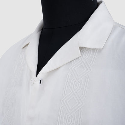 Close-up of white Tencel Cuban collar shirt with vertical embroidery detail