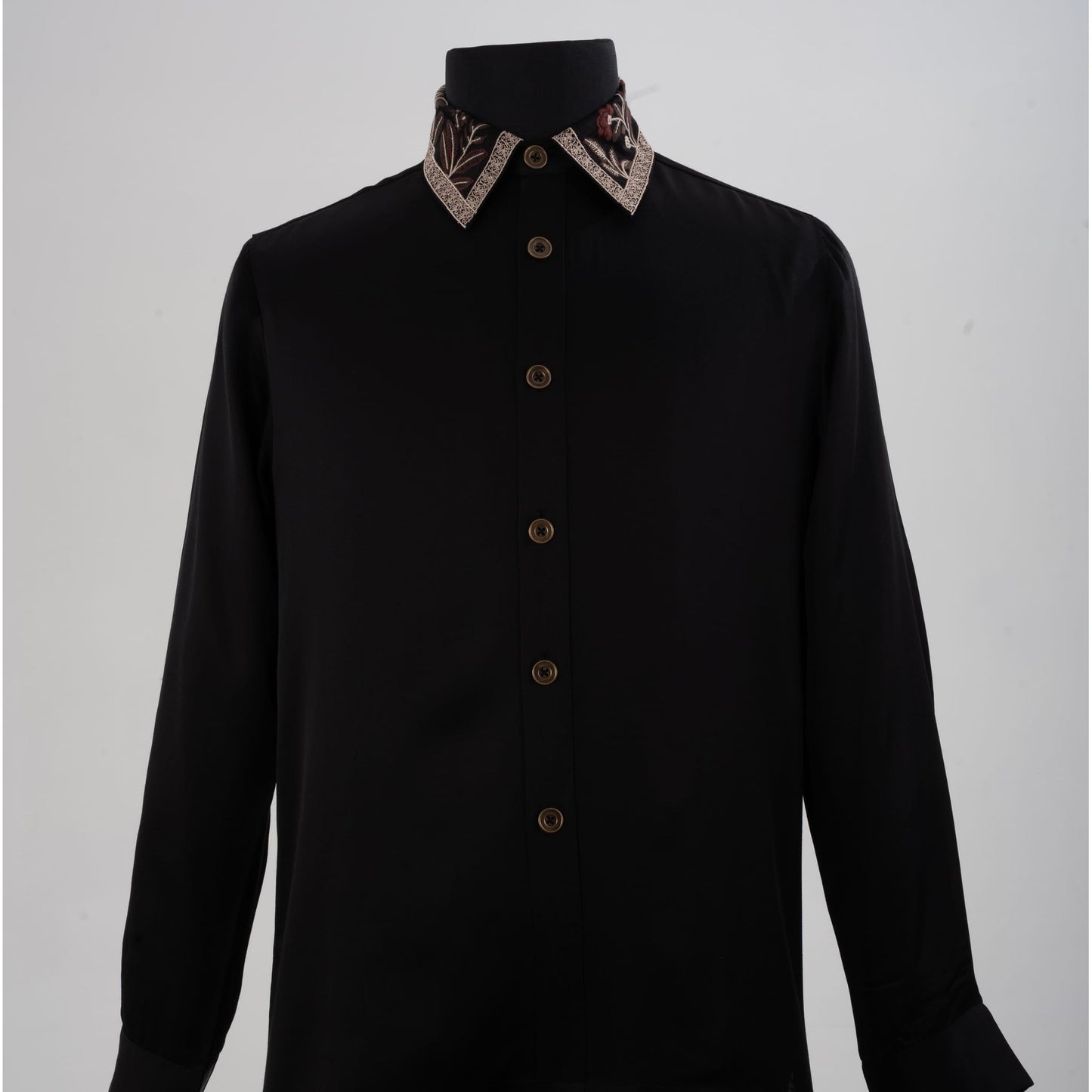 Front view of black linen-satin shirt with intricate floral embroidery on collar