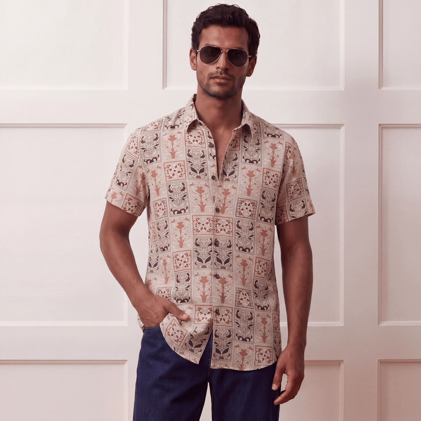 Short sleeve button-up viscose shirt styled with denim jeans