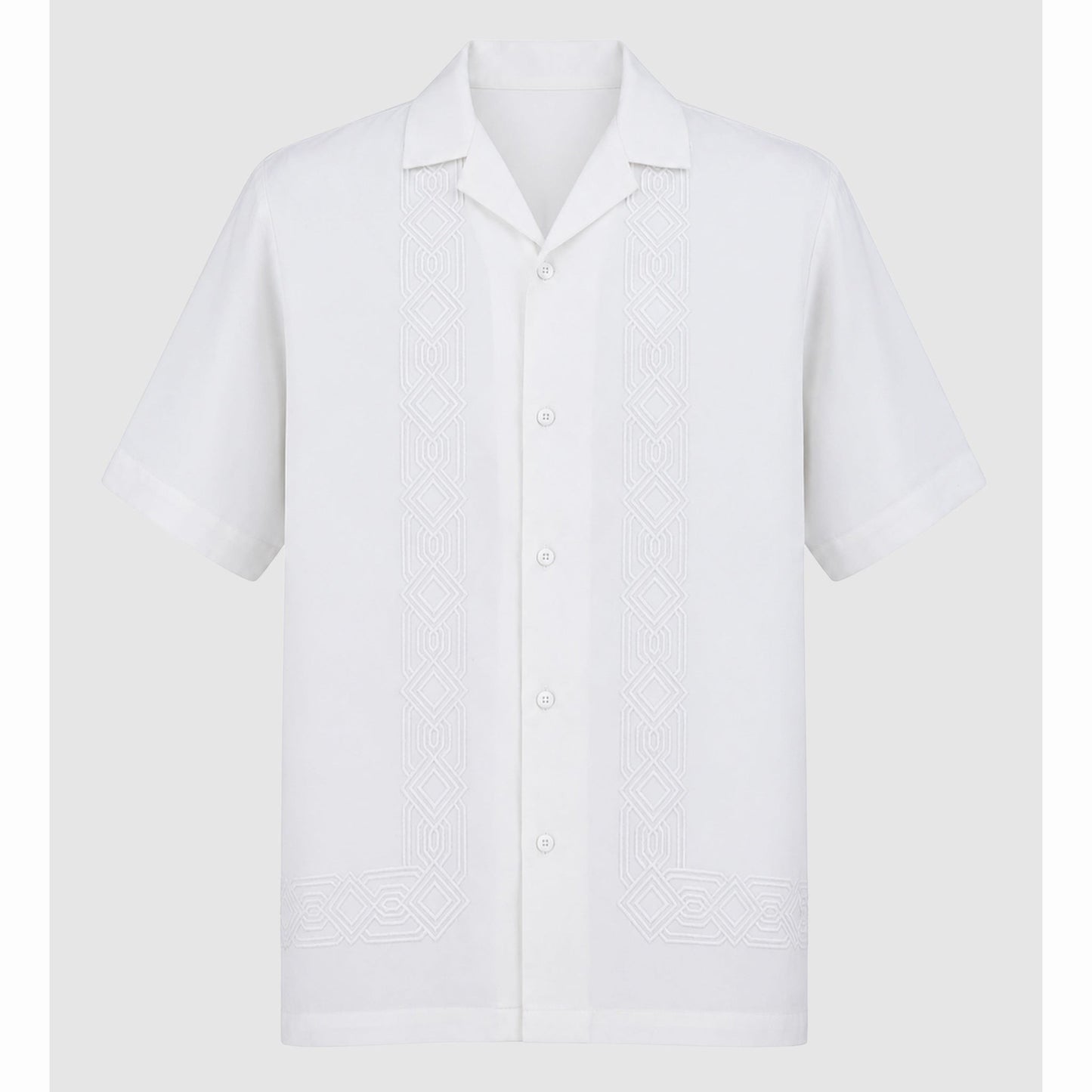 Flat lay of white short sleeve shirt with symmetrical front embroidery motifs