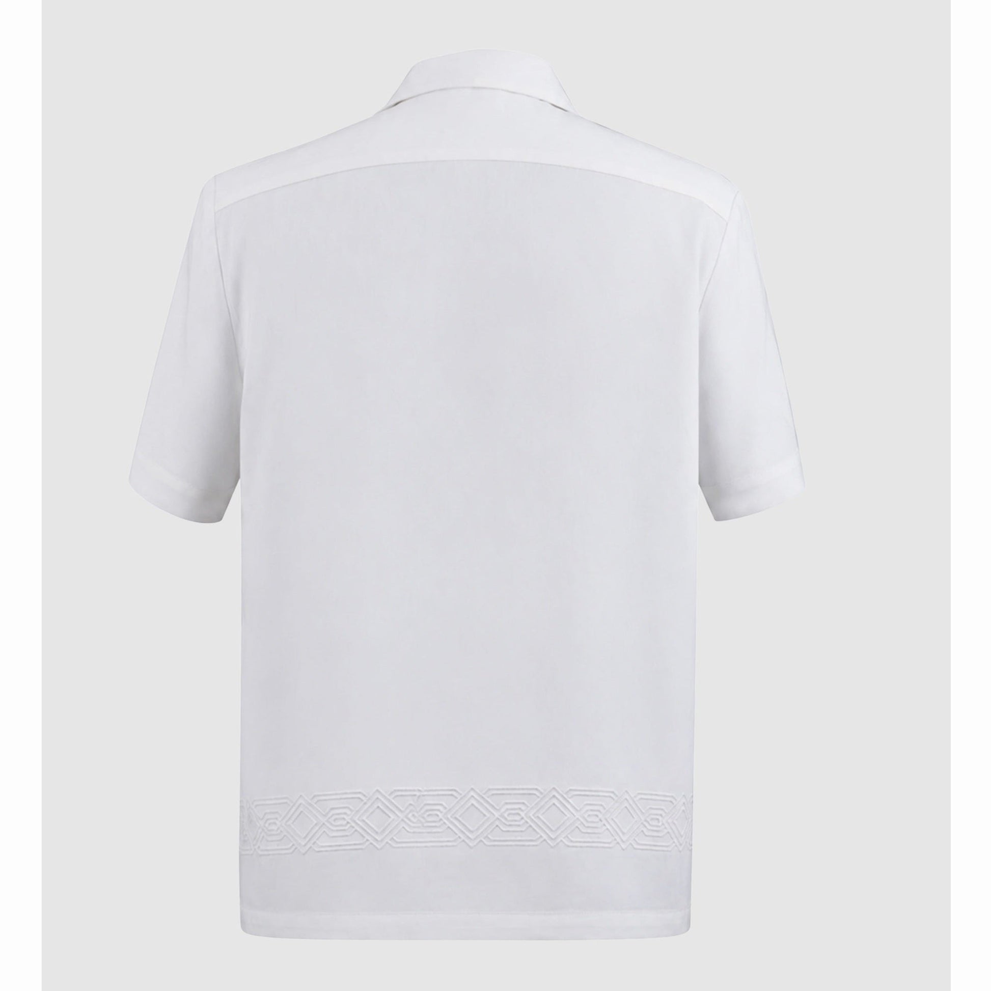 Back view of ivory shirt showing horizontal geometric embroidery band at hem