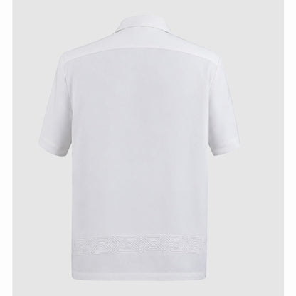 Back view of ivory shirt showing horizontal geometric embroidery band at hem