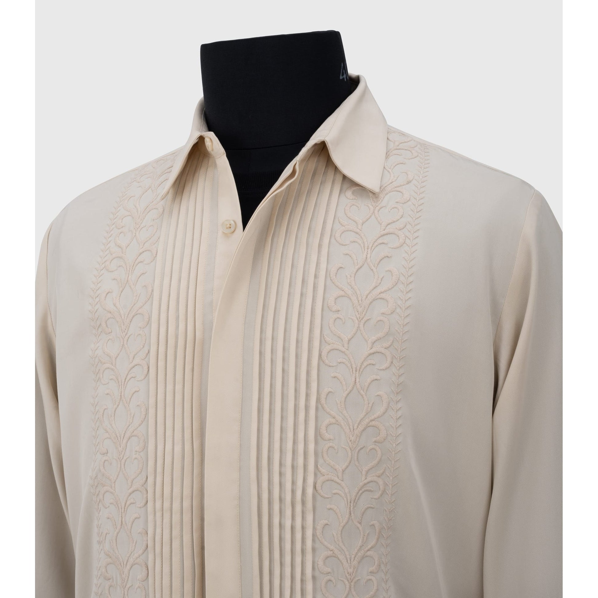 Close-up of floral embroidery and collar detail on cream Tencel shirt