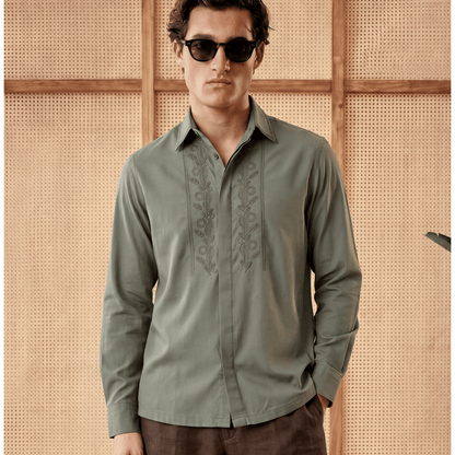 Man wearing olive embroidered Tencel shirt with floral placket detail