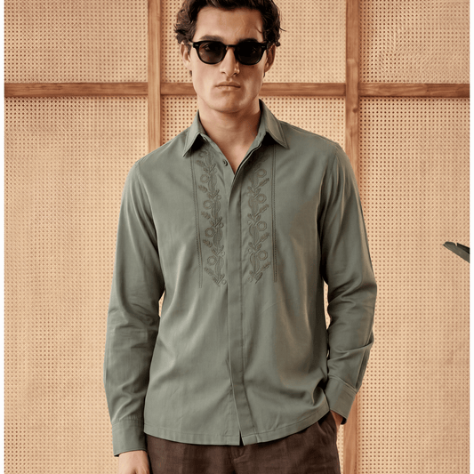 Man wearing olive embroidered Tencel shirt with floral placket detail