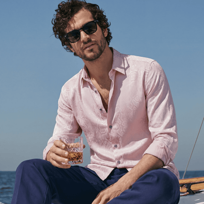 Pink viscose jacquard shirt rolled sleeves worn open on boat for summer soiree