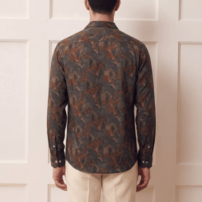 Back view of men's abstract expressionist print Cuban collar viscose shirt in earthy tones