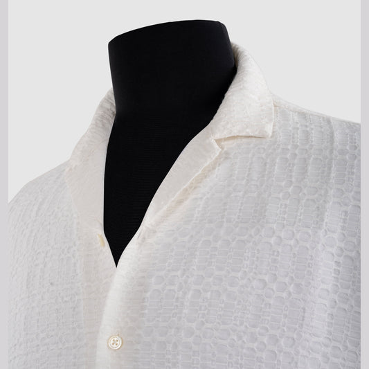 Close-up of white viscose jacquard shirt showing geometric weave detail