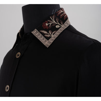 Close-up of black shirt collar featuring brown beige floral embroidery and lace trim