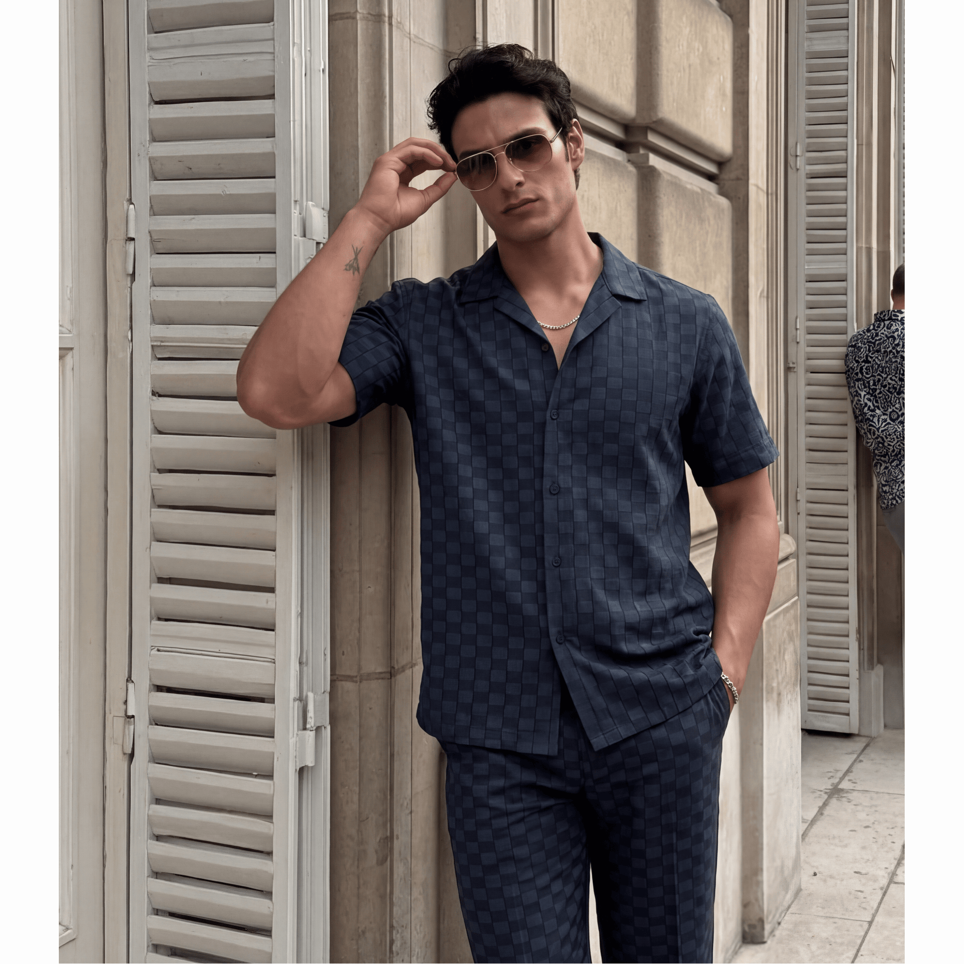 Dark blue relaxed fit Cuban collar shirt with raised checkered jacquard pattern