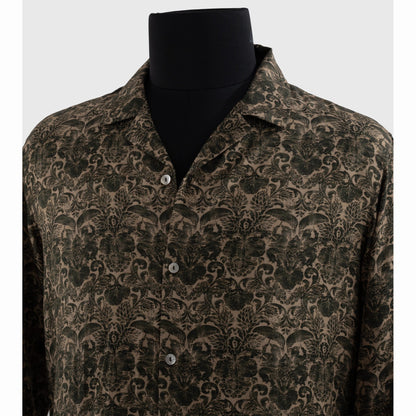Close-up of notched Cuban collar and metallic buttons on viscose shirt