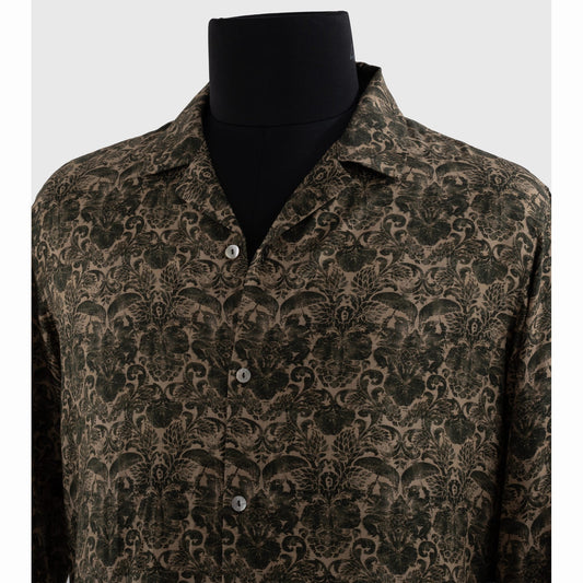 Close-up of notched Cuban collar and metallic buttons on viscose shirt