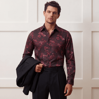 Men's dark red floral button-up shirt worn untucked for date night
