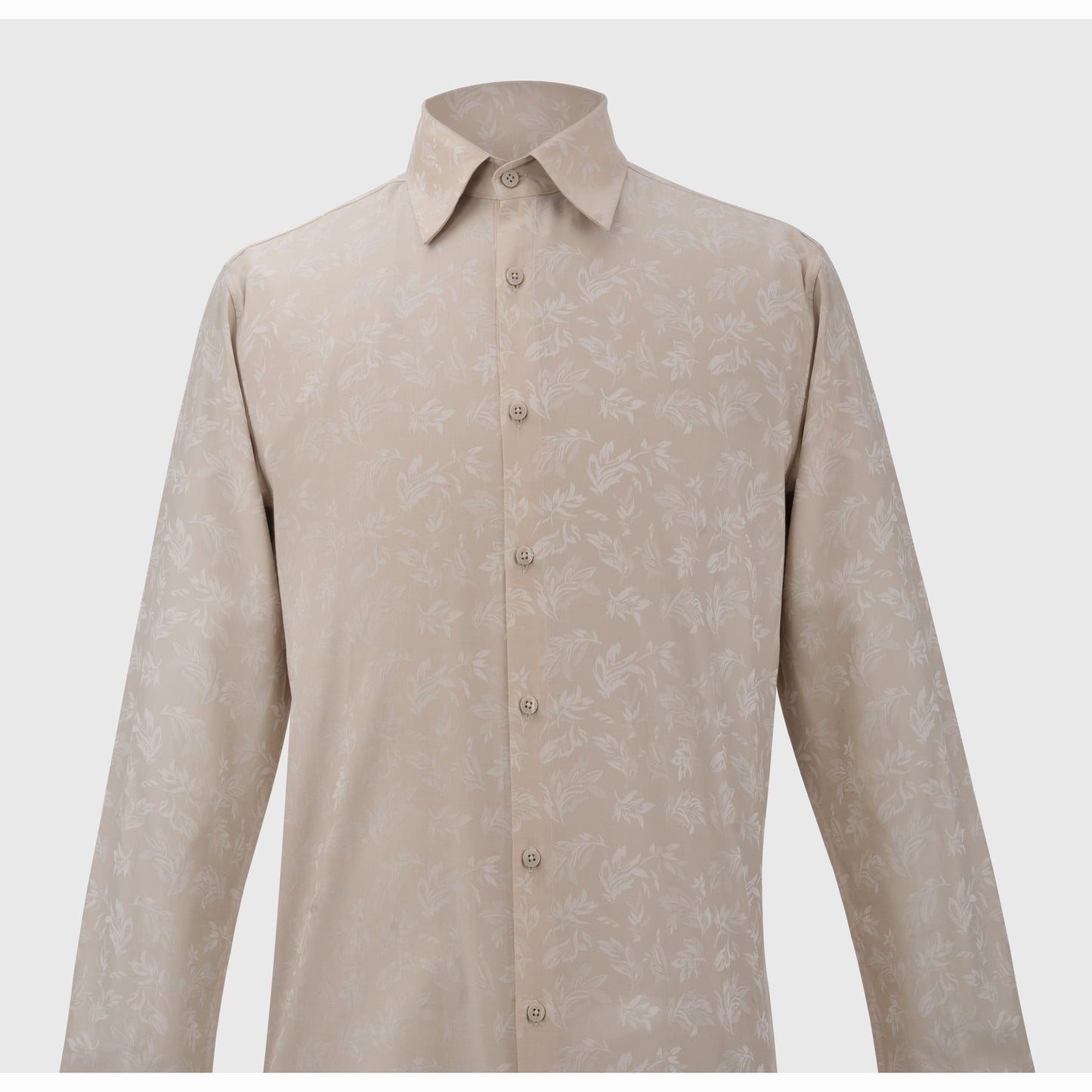 Front view of tailored light beige men's shirt with pointed collar and leafy jacquard design